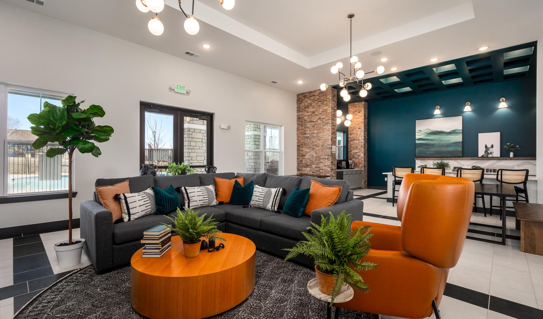 a lounge with a couch and chairs