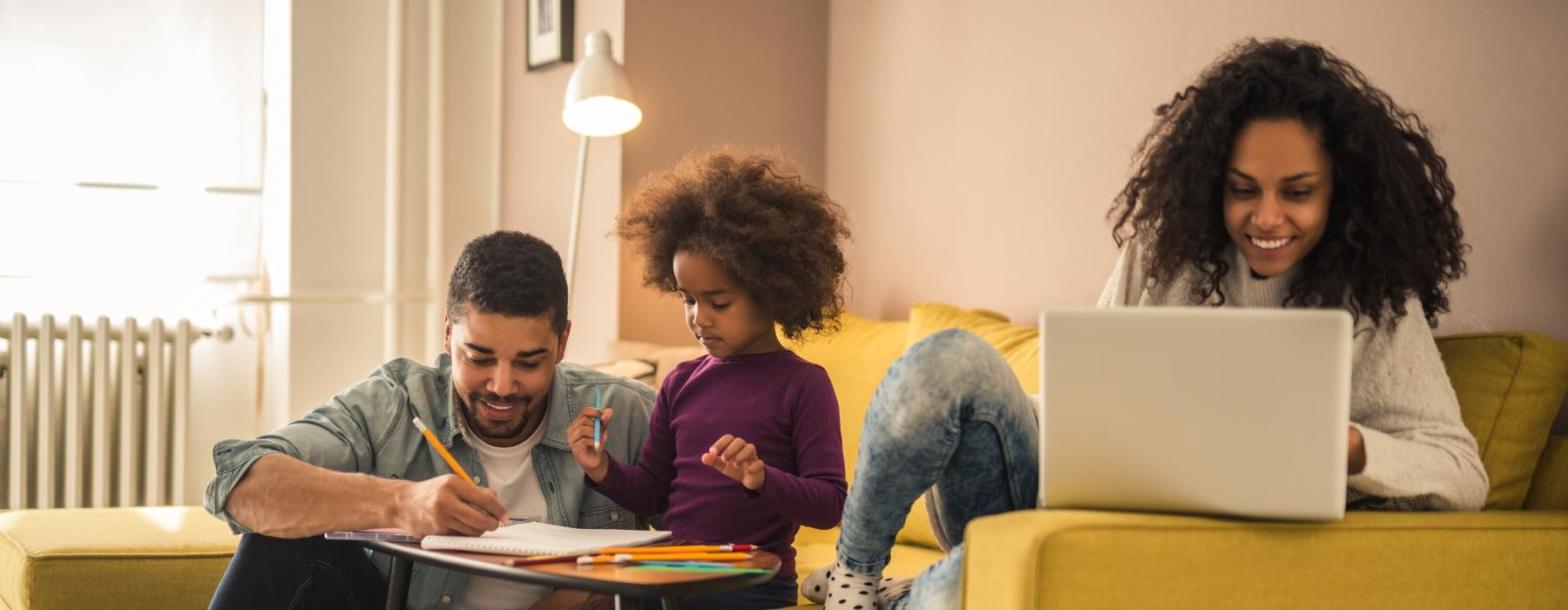 a family sitting on a couch