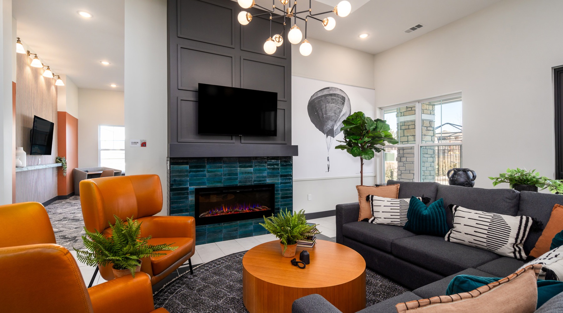 lounge with seating fireplace and tv